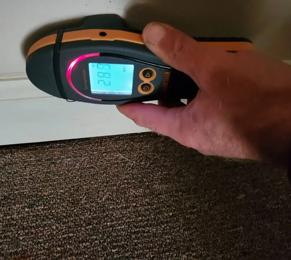 Moisture detection at baseboard during Storm Damage Restoration in Ossining